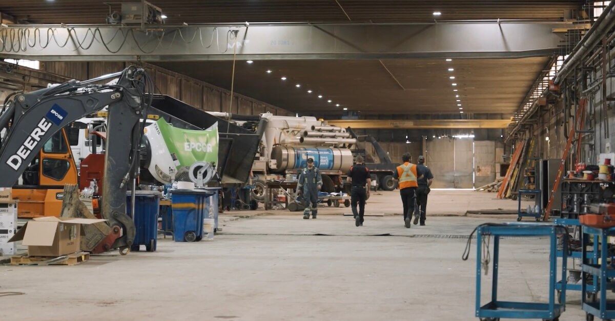 Mach 6 technicians walking the shop aisle in Edmonton