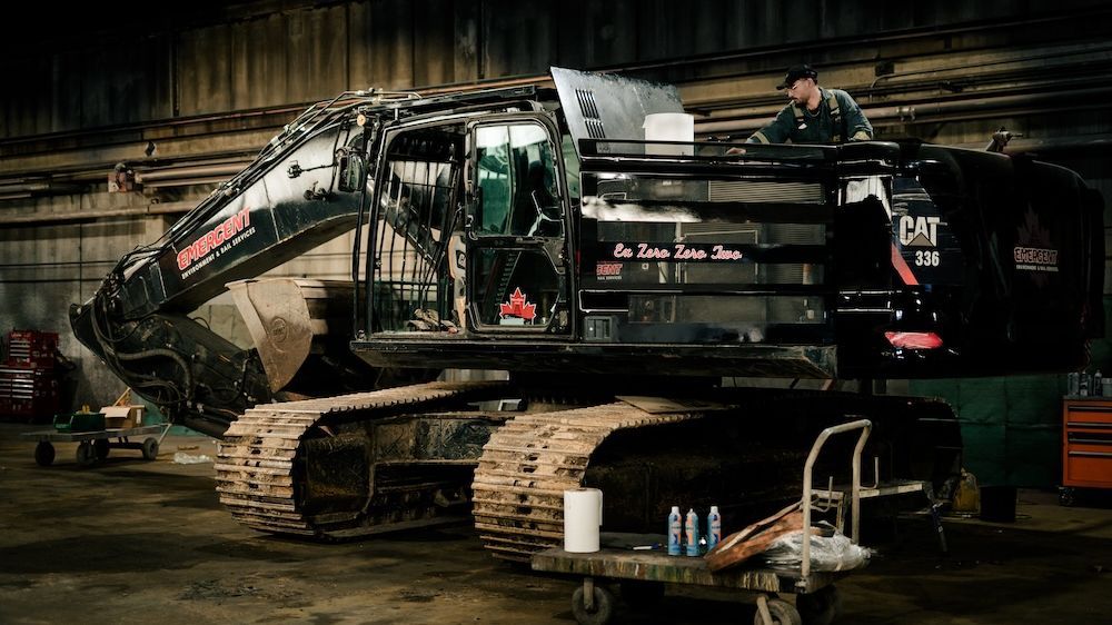 Tracked excavator in the Mach 6 service bay