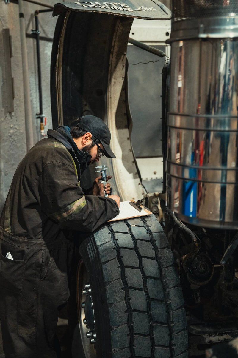 Technician performing a caliper inspection at Mach 6